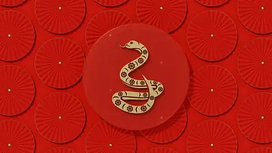Das chinesische Sternzeichen Schlange vor einem roten Hintergrund - Foto: akinbostanci/iStock