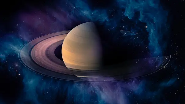 Ansicht auf Planet Saturn vor einer blauen Galaxie - Foto: Elen11/iStock