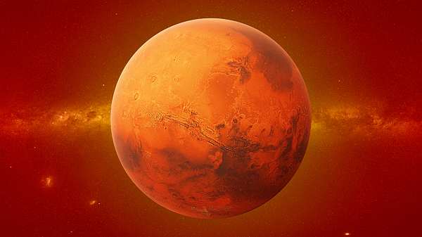 Planet Mars vor einer roten Galaxie - Foto: dottedhippo/iStock