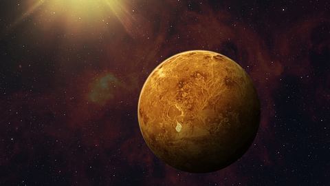 goldfarbener Planet vor braunem Hintergrund - Foto: buradaki/iStock