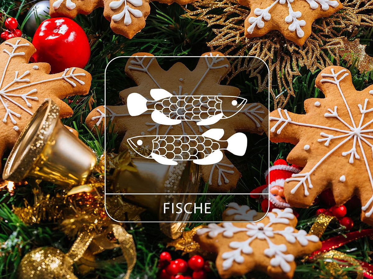 Sternzeichen Fische vor Weihnachtsplätzchen